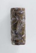 Cylinder seal with archer, mushhushshu and eigth-pointed star