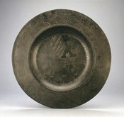 Dish with planets and dragon